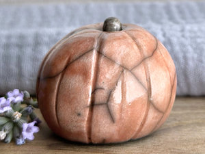 Slightly suspicious rustic pumpkin guardian sculpture for Halloween, Samhain, autumn, fall
