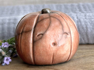Happy rustic pumpkin guardian spirit sculpture for Halloween, Samhain, autumn, fall