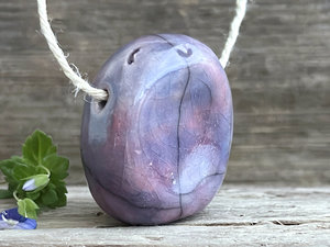 Happy guardian worry stone ceramic pendant (violet/mauve), adjustable flax cord