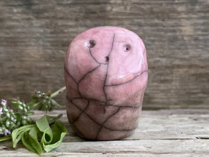 raku ceramic nature spirit sculpture with a sweet, upturned oooo face. it's glazed in a bottom-to-top gradient of warm brown to pinky mauve.