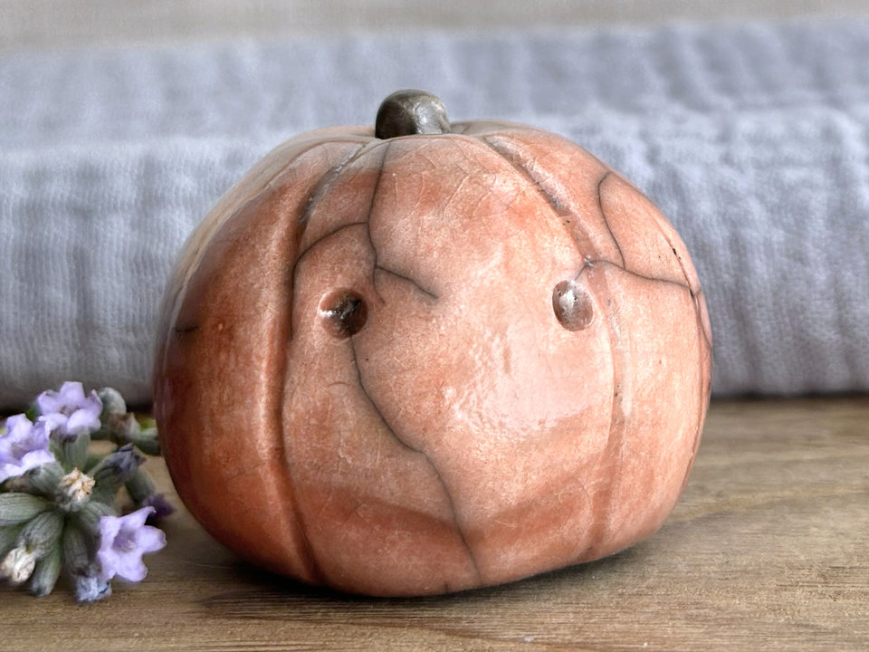 Slightly suspicious rustic pumpkin guardian sculpture for Halloween, Samhain, autumn, fall