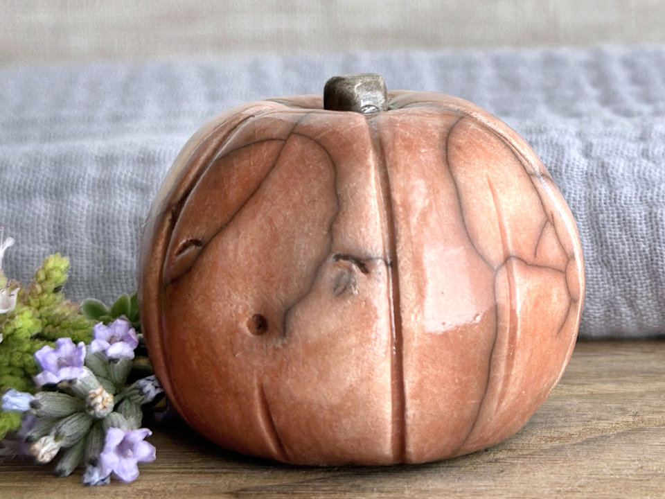 Happy rustic pumpkin guardian spirit sculpture for Halloween, Samhain, autumn, fall