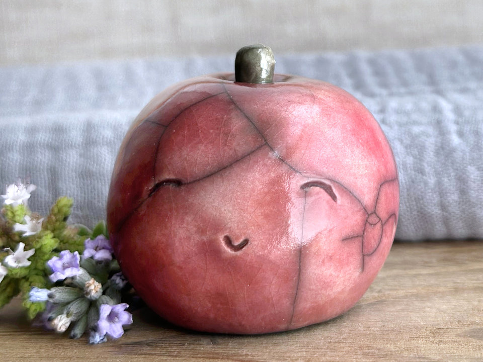 Happy apple guardian spirit sculpture for Halloween, Samhain, autumn, fall