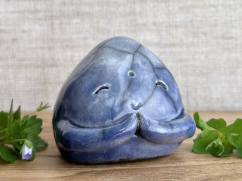 A smiley, loving, and very happy Jizo Shinto raku ceramic sculpture glazed in blue with sweet little praying hands.